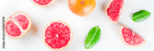 Whole and sliced grapefruit isolated on white background