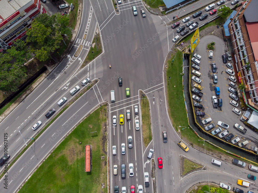 Aerial Drone image of car moving on surrounding Residential area at Kota Kinabalu, Sabah, Malaysia