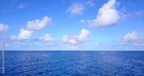 Wallpaper Mural Picturesque seascape with beautiful clouds hanging on light blue sky over deep blue endless ocean in Hawaii Torontodigital.ca