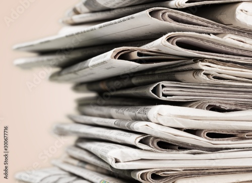 Canvas Print Pile of newspapers on background, close-up view