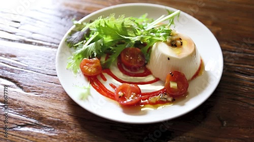 Tomato mozzarella prepared on a plate photo