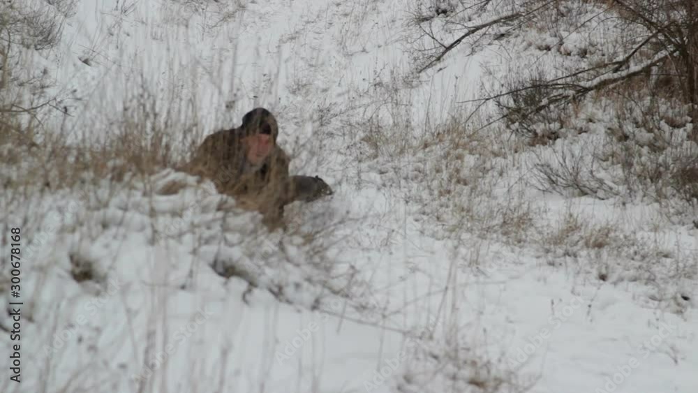 man rides on a sleigh,man on his stomach rides on a sled from a mountain man rides on a sleigh,man on his stomach rides on a sled from a mountain