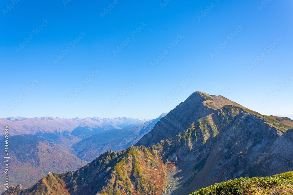 Mountain top in the distance panorama of mountain landscape in fine clear weather. Mountain top in the distance panorama of mountain landscape in fine clear weather.