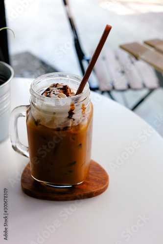 Ice coffee with whipped cream and coffee