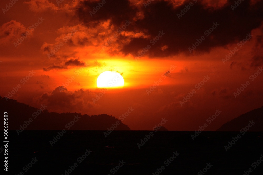 Beautiful seascape and tropical island with sky in twilight of sunset over the mountain in sea at Thailand Beautiful seascape and tropical island with sky in twilight of sunset over the mountain in sea at Thailand