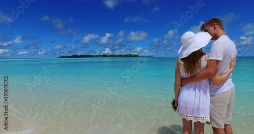 excited Romantic Bride And Groom, Kissing And Embracing On Tropical Beach photo