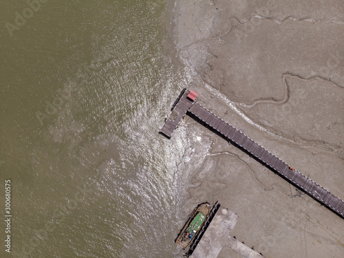 Aerial Drone view of beautiful rural landscape view with traditional wooden jetty at Muara Tebas, Kuching, Sarawak, Malaysia