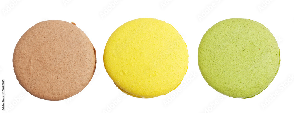 Closeup three different colored macaroons isolated on white. Top view.