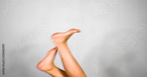 Various Upside Down Female Bare Leg Movements (stretching, crossing, cycling) Isolated on White photo