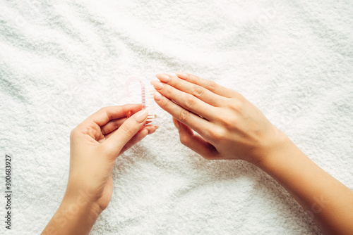 Brushing nails. Salon Nail Care.