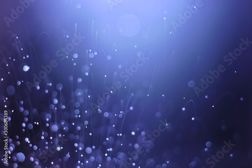 Dark blue abstract backgrounds with bokeh 