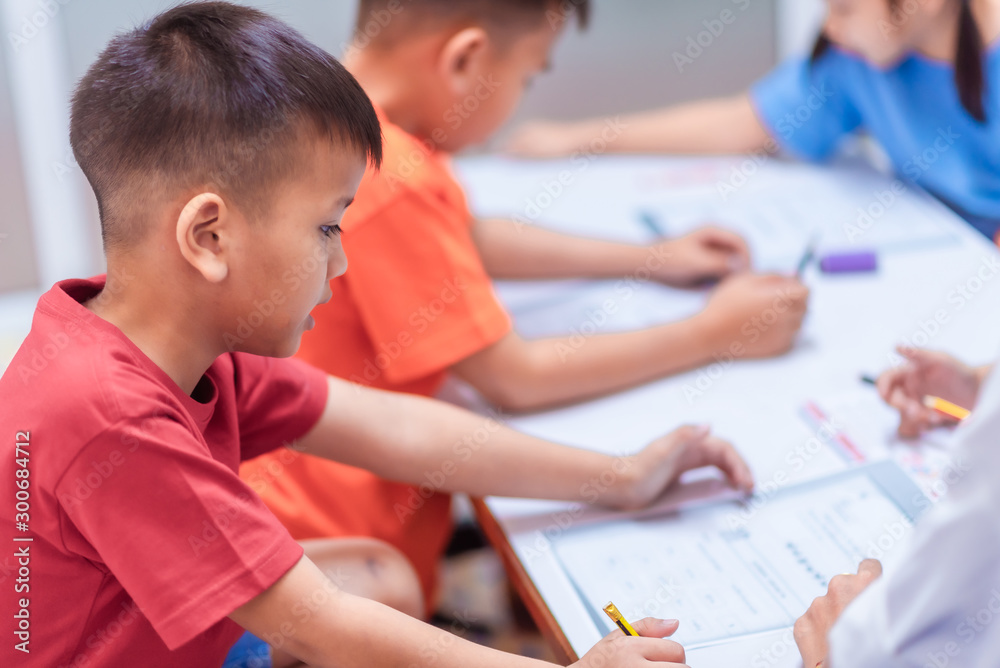 Asian elementary school children are studying in the classroom. Asian elementary school children are studying in the classroom.