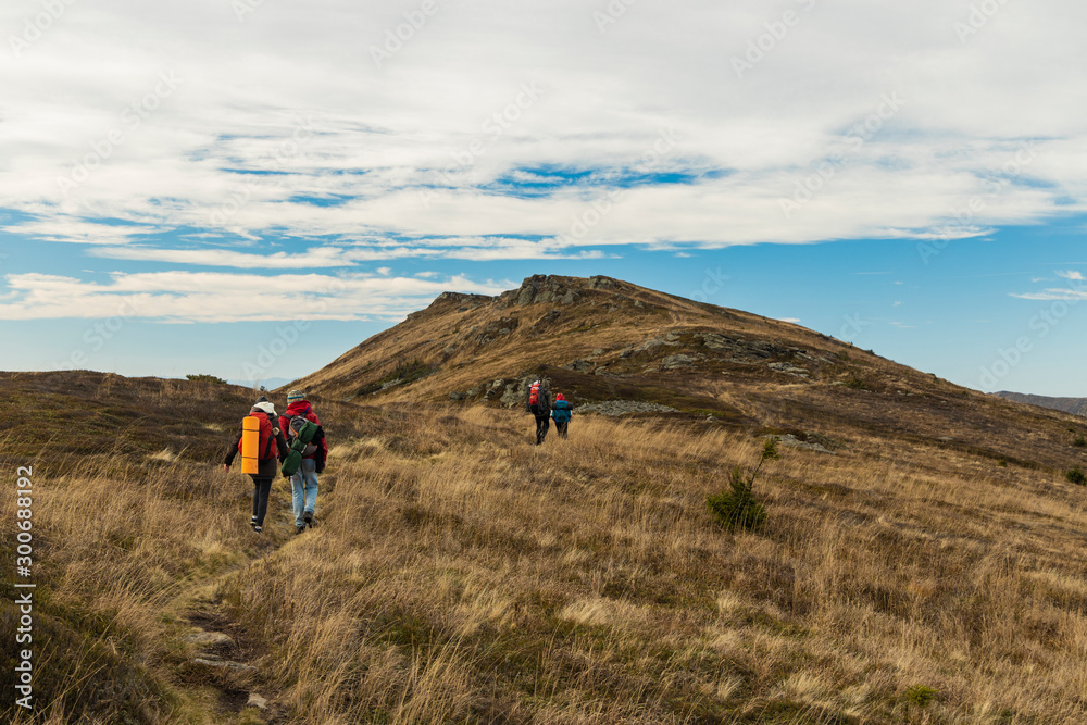 group of backpack people on touristic route highland picturesque mountain ridge in moody autumn windy cold weather time, travel life style concept landscape wallpaper photography group of backpack people on touristic route highland picturesque mountain ridge in moody autumn windy cold weather time, travel life style concept landscape wallpaper photography