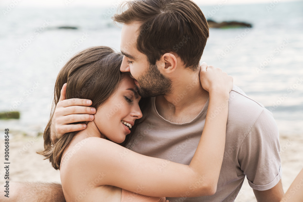 Photo of romantic young couple hugging and smiling Photo of romantic young couple hugging and smiling