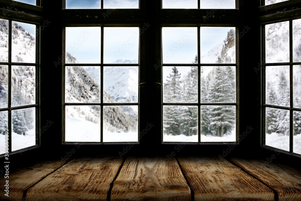 Table top with big window background and beautiful snowy winter landscape outside. Sunny winter day. Table top with big window background and beautiful snowy winter landscape outside. Sunny winter day.