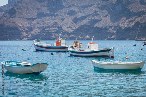 Fishing boats in Santorini, Greece. Fishing, summer, boats, travel, transport, holiday concept. photo