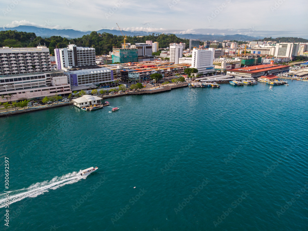 Kota Kinabalu cityscape aerial  photo with fisherman boat parking at Waterfront Kota Kinabalu. Kota Kinabalu is the capital of Malaysia’s Sabah state.