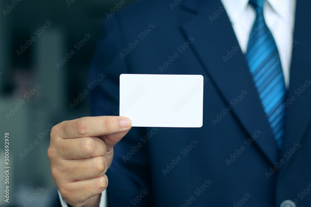 businessMan's hand showing business card businessMan's hand showing business card