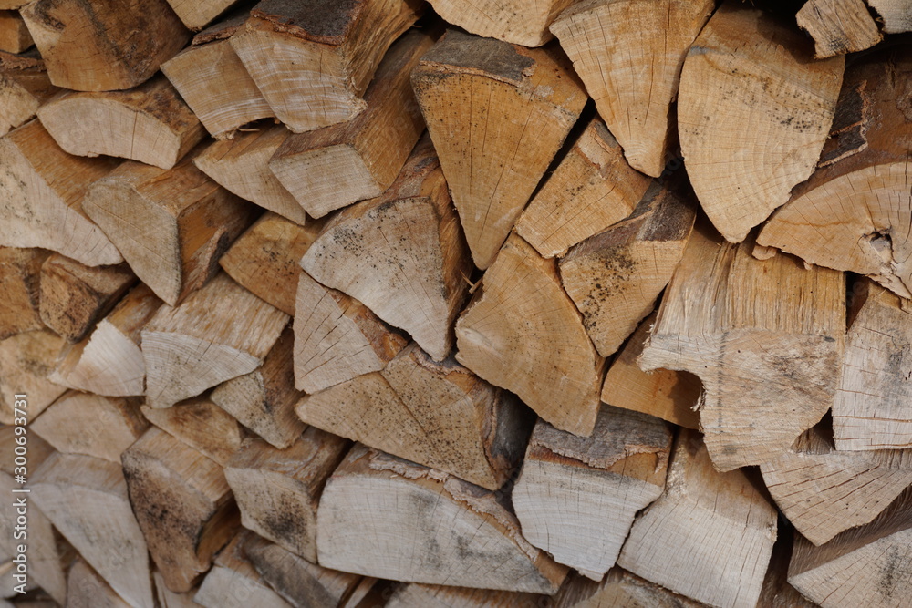 Firewood logs stacked from dried beech wood Firewood logs stacked from dried beech wood