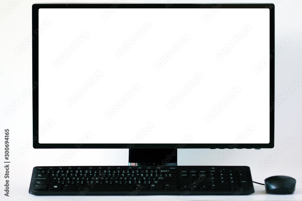 Soft focus and blur.Blank white computer screen on white table Soft focus and blur.Blank white computer screen on white table
