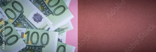 Euro cash on a pink and brown background. Euro Money Banknotes. Euro Money. Euro bill. Place for text. photo