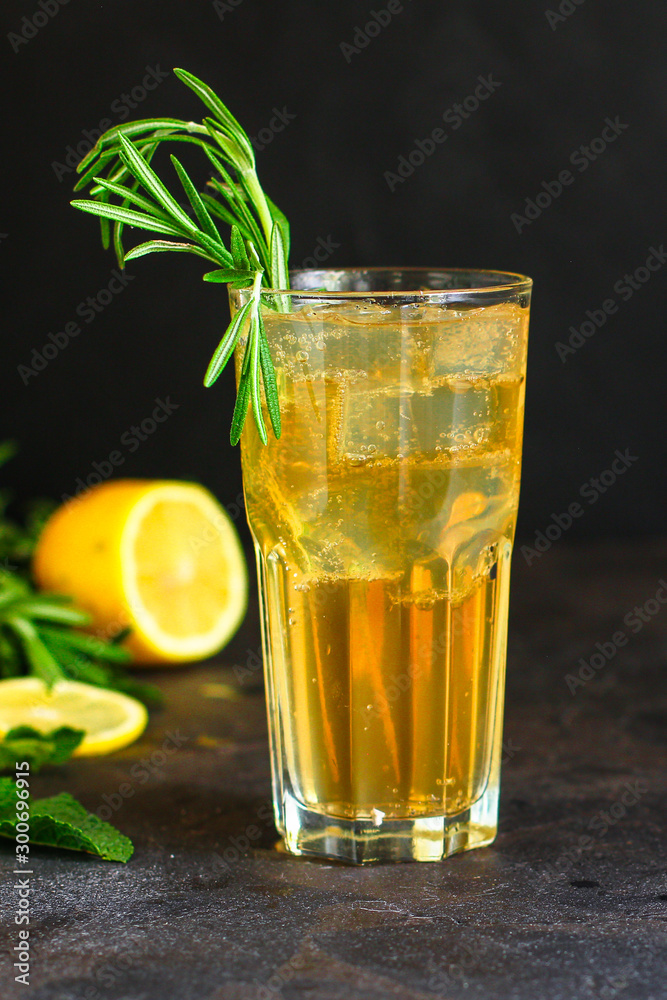 lemonade ice in a glass with rosemary (tasty drink, beverage) menu concept. food background. top view. copy space lemonade ice in a glass with rosemary (tasty drink, beverage) menu concept. food background. top view. copy space