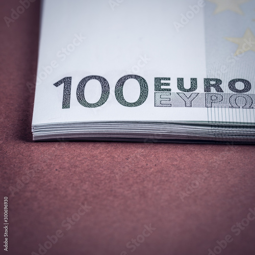 Euro cash on a pink and brown background. Euro Money Banknotes. Euro Money. Euro bill. Place for text.