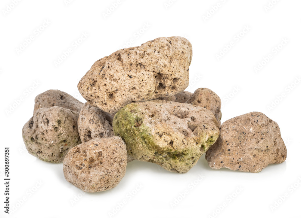 A natural piece of pumice stone isolated on white background. A natural piece of pumice stone isolated on white background.