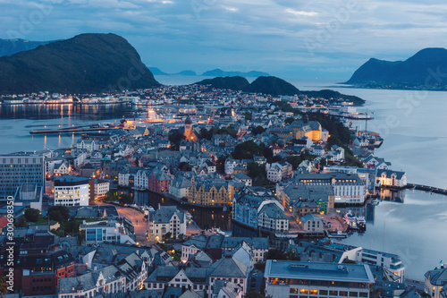 The beautiful scenic view over the city of aalesund in norway. Cities, city lights, island, fjords, scenery, landscape, nature, urban, northern, arctic concept. photo