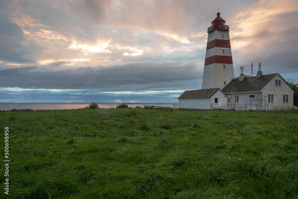 Lighthouse in Aalesund/Norway at sunset. Architecture, lighthouse, sky, clouds, sunset, summer.