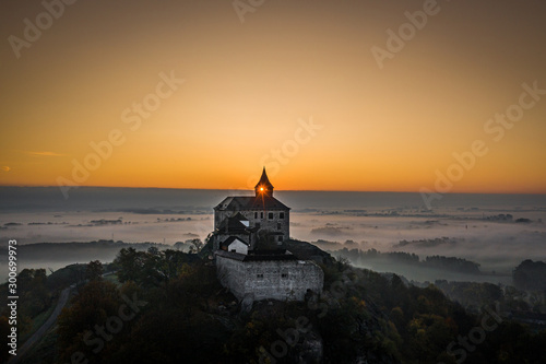 Kunetice Mountain sits in a plain, above which it rises 82 meters (305 m above sea level). Geologically, the mountain is a laccolith, dating from the Cenozoic era. Toward the end of the 19th century.	 photo