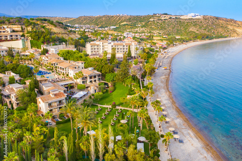 Cyprus. Pissouri resort. Pissouri beach panorama from a drone. Residential settlements and hotels in the valley at the mountains bottom. The Mediterranean blue lagoon. The Travel to Cyprus.