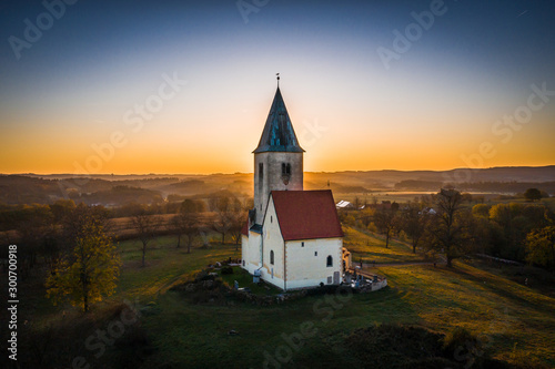 Church of St. James in Chvojno dates from the 13th century. It is situated on a hill above the Baroque farmyard Chvojen in the cadastral area of the town Benesov near by Prague. photo