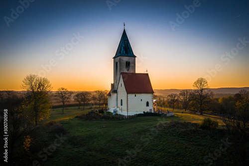 Church of St. James in Chvojno dates from the 13th century. It is situated on a hill above the Baroque farmyard Chvojen in the cadastral area of the town Benesov near by Prague.