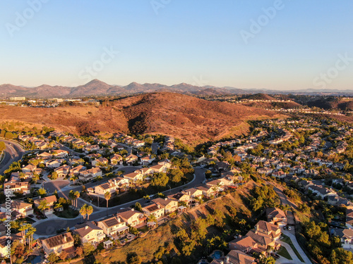 Aerial view of residential modern subdivision luxury house neighborhood during sunset. South California, USA