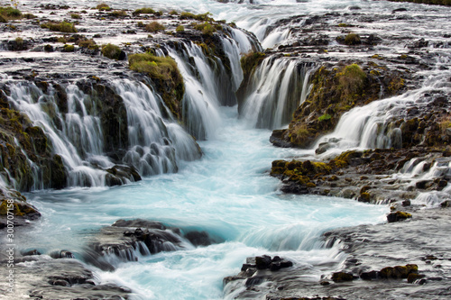 Waterfall cascade in Bruarfoss Iceland. Closeup  travel and photography concept.
