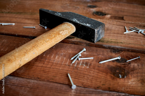 hammer and nails on dark table