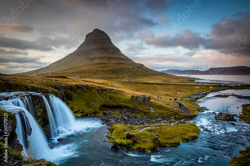 The picturesque sunset over landscapes and waterfalls. Kirkjufell mountain, Iceland