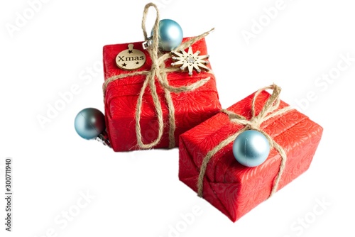 Christmas composition. Red Gifts box, wooden Christmas decorations on white background. Christmas, winter, new year concept. Flat lay, top view, copy spac