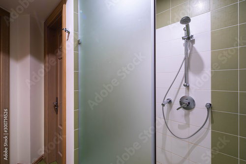 Shower in modern interior of bathroom.