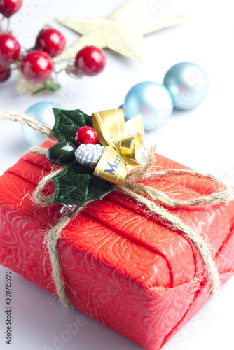Christmas composition. Red Gifts box, wooden Christmas decorations on white background. Christmas, winter, new year concept. Flat lay, top view, copy spac