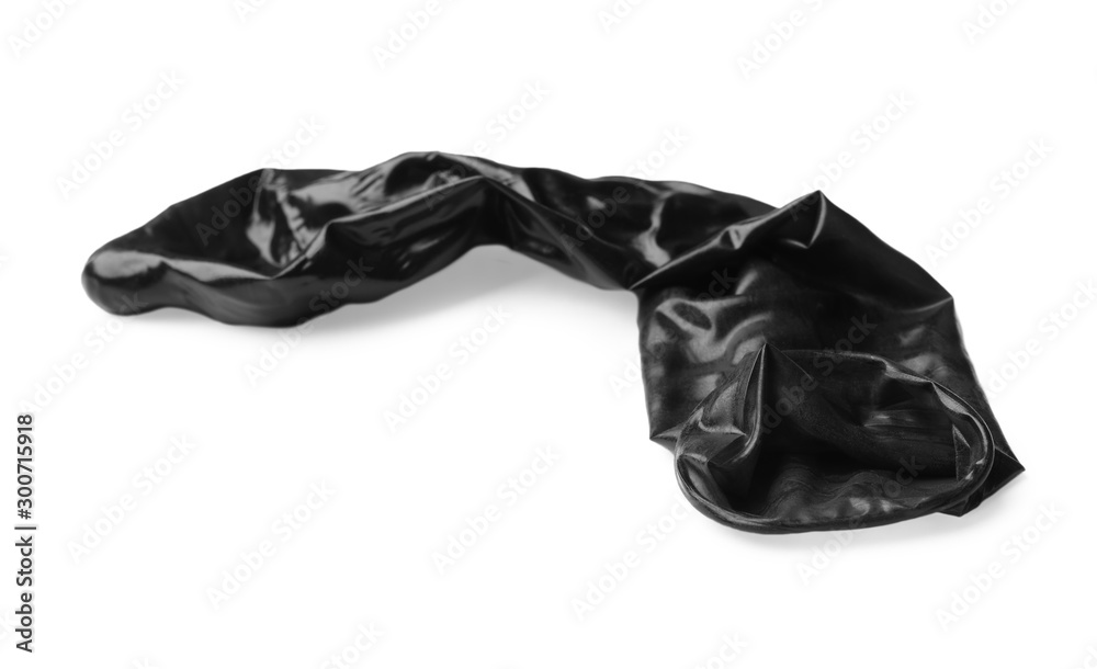 Black used condom on white background. Safe sex concept Black used condom on white background. Safe sex concept