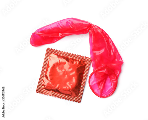 Red condoms on white background, top view. Safe sex concept