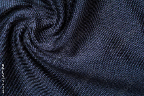 Fragment of crumpled gray polyester wear
