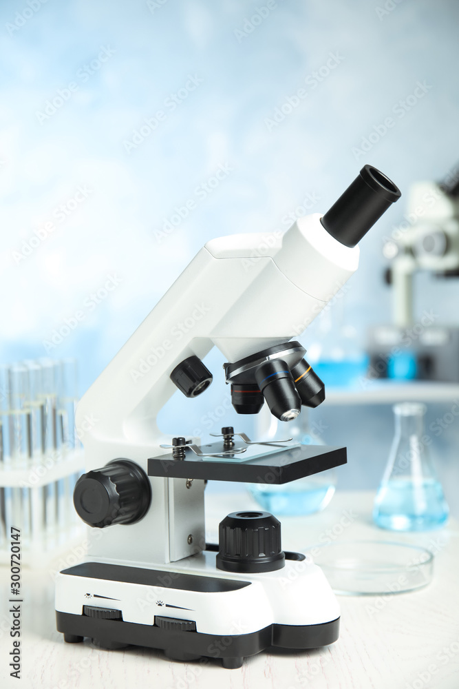 Modern microscope on table in laboratory. Medical equipment Modern microscope on table in laboratory. Medical equipment