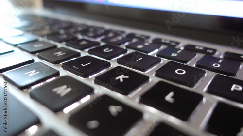 Photography close up shot of used laptop computer or notebook keyboard keys