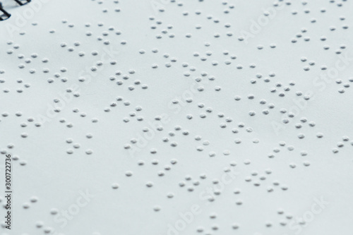 Braille font on paper. Close-up. Children's book...