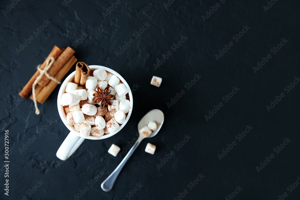 Mug of hot chocolate with marshmallows on a dark background. Top view, copy space. - obrazy, fototapety, plakaty 