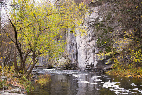 Buksky Canyon. View of the cliff. Foamy river and rocks. photo