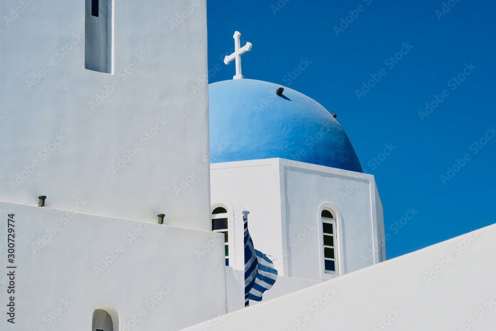 Greek Orthodox church in Santorini, Greece, white church with blue dome
